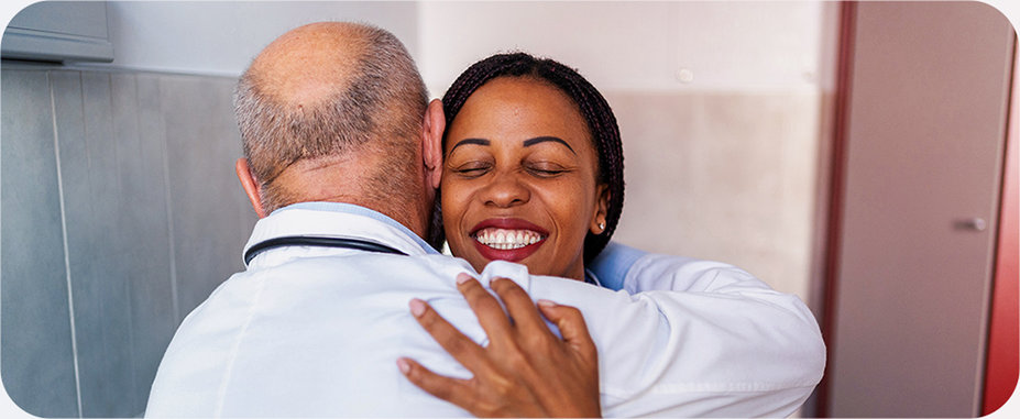 Patient hugging doctor